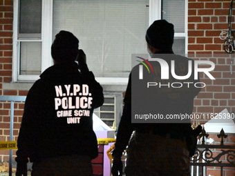 NYPD crime scene investigators search for evidence at the scene where a 30-year-old man is killed in an assault in the Throggs Neck section...