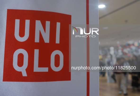 Customers shop at a UNIQLO store in Hangzhou, Zhejiang province, China, on December 1, 2024. 