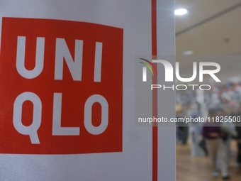 Customers shop at a UNIQLO store in Hangzhou, Zhejiang province, China, on December 1, 2024. (