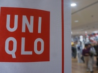 Customers shop at a UNIQLO store in Hangzhou, Zhejiang province, China, on December 1, 2024. (