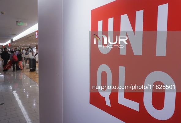 Customers shop at a UNIQLO store in Hangzhou, Zhejiang province, China, on December 1, 2024. 