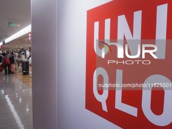 Customers shop at a UNIQLO store in Hangzhou, Zhejiang province, China, on December 1, 2024. (