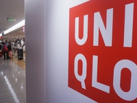 Customers shop at a UNIQLO store in Hangzhou, Zhejiang province, China, on December 1, 2024. (