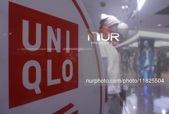 Customers shop at a UNIQLO store in Hangzhou, Zhejiang province, China, on December 1, 2024. 