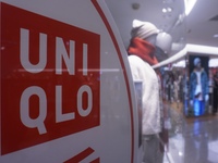 Customers shop at a UNIQLO store in Hangzhou, Zhejiang province, China, on December 1, 2024. (