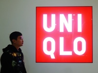 A citizen passes a UNIQLO store in Hangzhou, China, on December 1, 2024. (