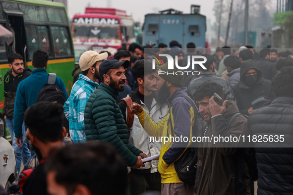 Kashmiri unemployed youth stand outside an examination center in Baramulla, Jammu and Kashmir, India, on December 1, 2024. More than 5.59 la...