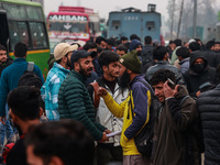 Kashmiri unemployed youth stand outside an examination center in Baramulla, Jammu and Kashmir, India, on December 1, 2024. More than 5.59 la...