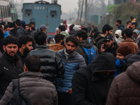 Kashmiri unemployed youth stand outside an examination center in Baramulla, Jammu and Kashmir, India, on December 1, 2024. More than 5.59 la...