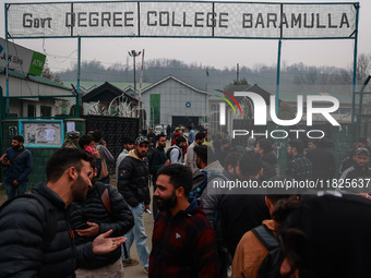 Kashmiri unemployed youth stand outside an examination center in Baramulla, Jammu and Kashmir, India, on December 1, 2024. More than 5.59 la...