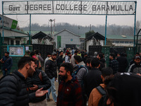 Kashmiri unemployed youth stand outside an examination center in Baramulla, Jammu and Kashmir, India, on December 1, 2024. More than 5.59 la...