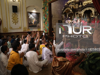 Monks and devotees of ISKCON in Kolkata, India, hold a prayer protest against the recent arrest of ISKCON Bangladesh priest Chinmoy Krishna...