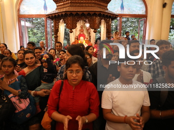 Monks and devotees of ISKCON in Kolkata, India, hold a prayer protest against the recent arrest of ISKCON Bangladesh priest Chinmoy Krishna...