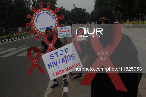 Social activists perform an awareness program on the wayside in observation of World AIDS Day in Bhubaneswar, Odisha, India, on December 1,...