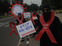 Social activists perform an awareness program on the wayside in observation of World AIDS Day in Bhubaneswar, Odisha, India, on December 1,...