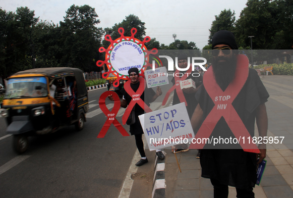 Social Activists Are Seen On Wayside They Are Performing Awareness Program On The Observation Of World AIDs Day In The Eastern Indian State...