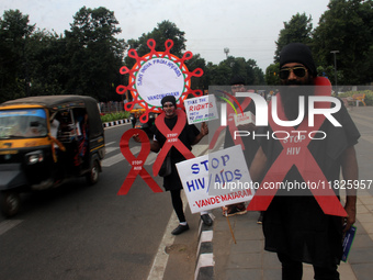 Social Activists Are Seen On Wayside They Are Performing Awareness Program On The Observation Of World AIDs Day In The Eastern Indian State...