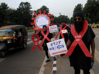 Social Activists Are Seen On Wayside They Are Performing Awareness Program On The Observation Of World AIDs Day In The Eastern Indian State...