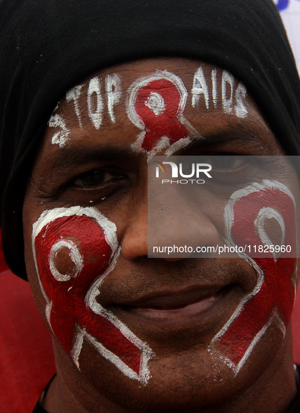 Social Activists Are Seen On Wayside They Are Performing Awareness Program On The Observation Of World AIDs Day In The Eastern Indian State...