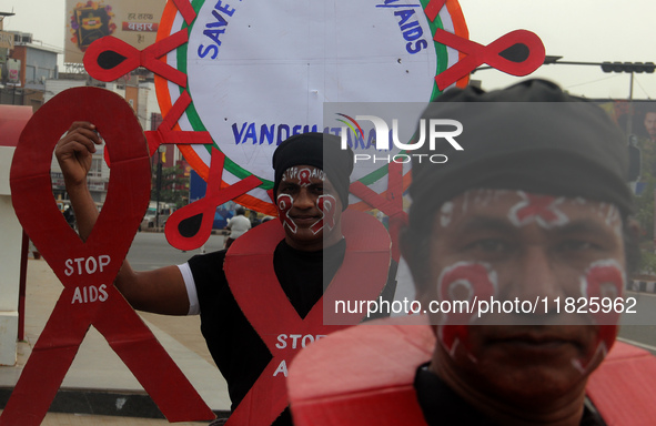 Social Activists Are Seen On Wayside They Are Performing Awareness Program On The Observation Of World AIDs Day In The Eastern Indian State...