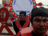 Social Activists Are Seen On Wayside They Are Performing Awareness Program On The Observation Of World AIDs Day In The Eastern Indian State...