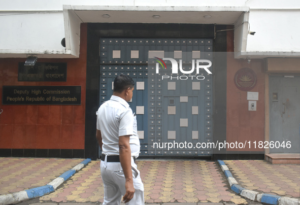 A Kolkata police officer passes next to the Bangladesh High Commissioner's office in Kolkata, India, on December 1, 2024. Security is impose...