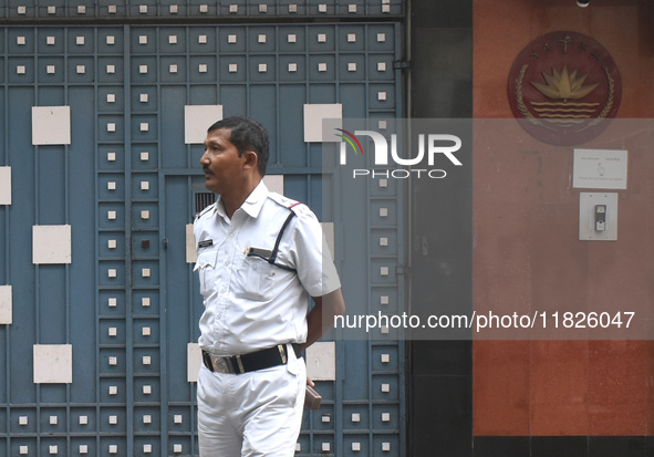 A Kolkata police officer stands in front of the Bangladesh High Commissioner's office in Kolkata, India, on December 1, 2024. Security is im...