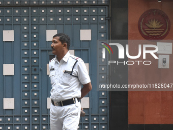 A Kolkata police officer stands in front of the Bangladesh High Commissioner's office in Kolkata, India, on December 1, 2024. Security is im...