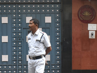 A Kolkata police officer stands in front of the Bangladesh High Commissioner's office in Kolkata, India, on December 1, 2024. Security is im...