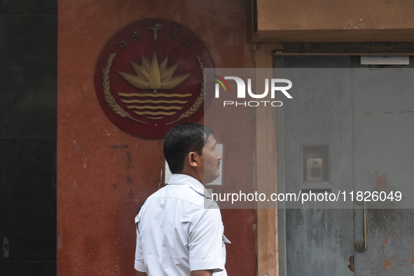 A Kolkata police officer stands in front of the Bangladesh High Commissioner's office in Kolkata, India, on December 1, 2024. Security is im...