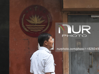 A Kolkata police officer stands in front of the Bangladesh High Commissioner's office in Kolkata, India, on December 1, 2024. Security is im...