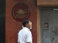 A Kolkata police officer stands in front of the Bangladesh High Commissioner's office in Kolkata, India, on December 1, 2024. Security is im...