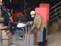 A Nepali voter casts a vote in the local by-election at a polling center in Kathmandu, Nepal, on December 1, 2024. A periodic election to el...