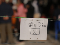 A sign reading ''No entry'' in Nepali script hangs at a polling station in Kathmandu, Nepal, on December 1, 2024. A periodic election to ele...