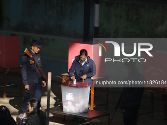 A Nepali voter casts a vote in the local by-election at a polling center in Kathmandu, Nepal, on December 1, 2024. A periodic election to el...