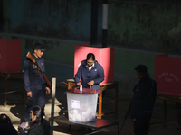 A Nepali voter casts a vote in the local by-election at a polling center in Kathmandu, Nepal, on December 1, 2024. A periodic election to el...