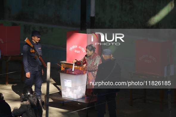 A Nepali voter casts a vote in the local by-election at a polling center in Kathmandu, Nepal, on December 1, 2024. A periodic election to el...