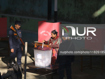 A Nepali voter casts a vote in the local by-election at a polling center in Kathmandu, Nepal, on December 1, 2024. A periodic election to el...