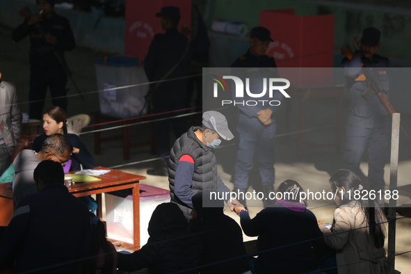 A Nepali voter casts a vote in the local by-election at a polling center in Kathmandu, Nepal, on December 1, 2024. A periodic election to el...