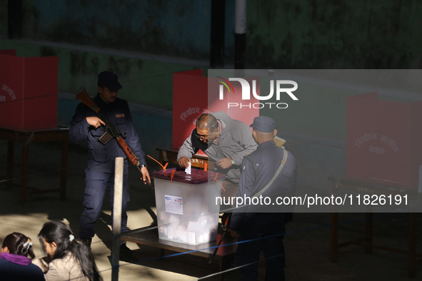 A Nepali voter casts a vote in the local by-election at a polling center in Kathmandu, Nepal, on December 1, 2024. A periodic election to el...