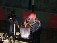 A Nepali voter casts a vote in the local by-election at a polling center in Kathmandu, Nepal, on December 1, 2024. A periodic election to el...