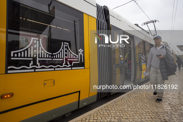 A person walks in Lisbon, Portugal, on December 1, 2024. The capital of Portugal is one of Europe's oldest and most vibrant cities. It is kn...