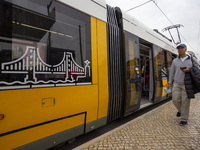 A person walks in Lisbon, Portugal, on December 1, 2024. The capital of Portugal is one of Europe's oldest and most vibrant cities. It is kn...