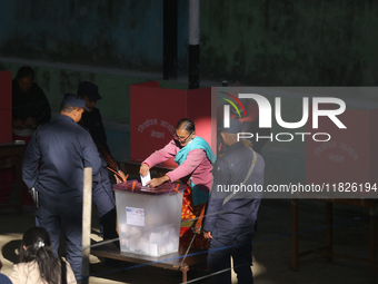 A Nepali voter casts a vote in the local by-election at a polling center in Kathmandu, Nepal, on December 1, 2024. A periodic election to el...