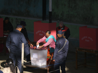 A Nepali voter casts a vote in the local by-election at a polling center in Kathmandu, Nepal, on December 1, 2024. A periodic election to el...