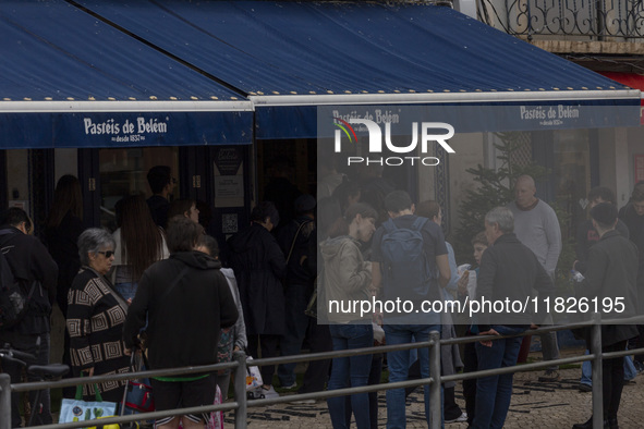 People wait in line to enter a pastry shop in Lisbon, Portugal, on December 1, 2024. Lisbon, the capital of Portugal, is one of Europe's old...