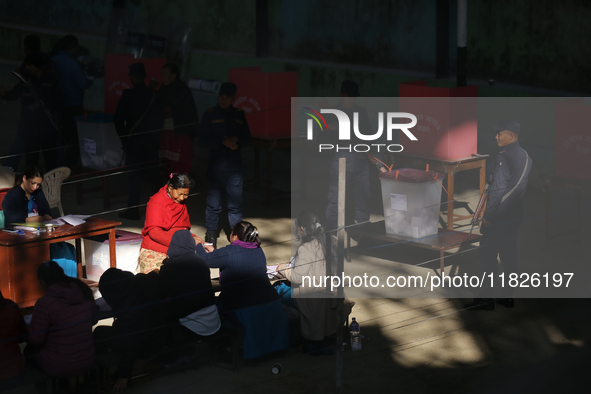 A Nepali voter casts a vote in the local by-election at a polling center in Kathmandu, Nepal, on December 1, 2024. A periodic election to el...