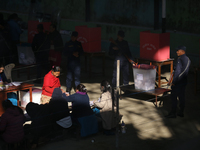 A Nepali voter casts a vote in the local by-election at a polling center in Kathmandu, Nepal, on December 1, 2024. A periodic election to el...