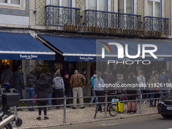 People wait in line to enter a pastry shop in Lisbon, Portugal, on December 1, 2024. Lisbon, the capital of Portugal, is one of Europe's old...