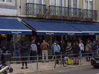 People wait in line to enter a pastry shop in Lisbon, Portugal, on December 1, 2024. Lisbon, the capital of Portugal, is one of Europe's old...